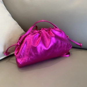 Fuchsia cloud clutch bag with ruched leather and gold clip closure for women