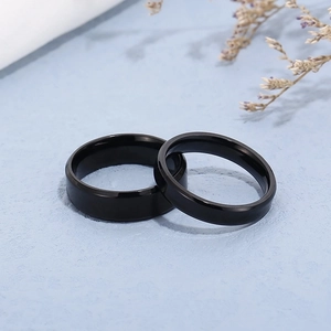 Polished black stainless steel couple rings set with smooth beveled edges for lovers
