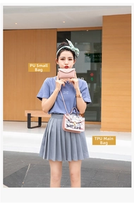 Detail view of transparent TPU daisy tote bag with pink PU leather inner envelope pouch