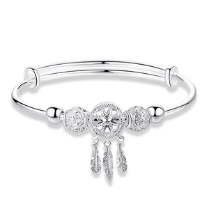 Minimalist 999 silver dreamcatcher bangle with feather tassels on a white background
