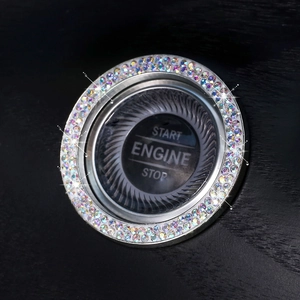Close-up of sparkling crystal car ignition button cover with silver rhinestone ring
