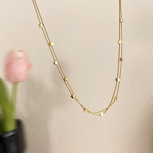Elegant gold double-layered snake chain necklace with mini square pendants for women