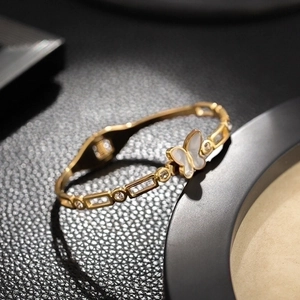 Luxury 18K gold butterfly bangle with shell inlay and cubic zirconia accents