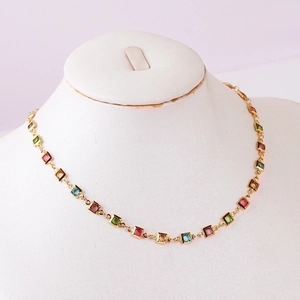 18K gold plated necklace featuring colorful square zircon stones on a white mannequin