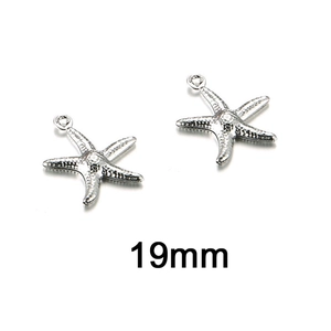 Macro shot of 19mm silver starfish pendant charms showing realistic textured surface