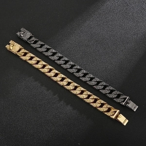 Detailed relief textures on black and gold Cuban link bracelets with animal engravings