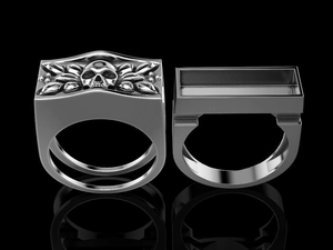 Macro detail of punk skull rings in vintage silver finish with intricate metal carvings