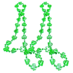 Macro detail of two green Irish clover and beer mug bead necklaces for St. Patrick's Day