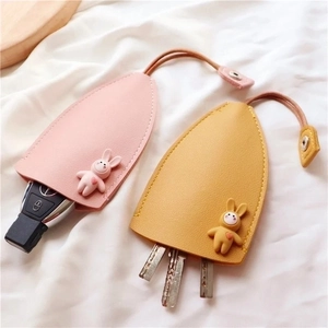 Cute leather cartoon rabbit key covers in pink and yellow for home and car keys
