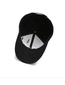 Close-up of black baseball cap interior showing white reinforced fabric and neat stitching
