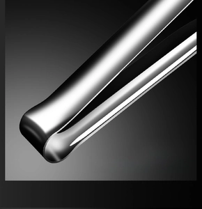 Close-up of polished 304 stainless steel food tongs with mirror finish and curved design