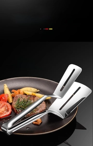 Macro detail of 304 stainless steel food tong with drain holes for frying and grilling