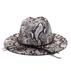 Detail of wide brim fedora hat featuring black snake skin texture and brown leather cord