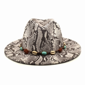 Detail of snake skin print fedora featuring bohemian turquoise and shell beaded band