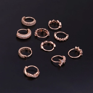 Rose gold cartilage earrings and nose rings set with clear cubic zirconia accents