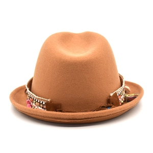 Brown wool fedora hat with bohemian ethnic band featuring beads and tassels on white background