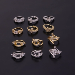 Detailed set of 12 gold and silver zircon cartilage rings with stars and cross charms