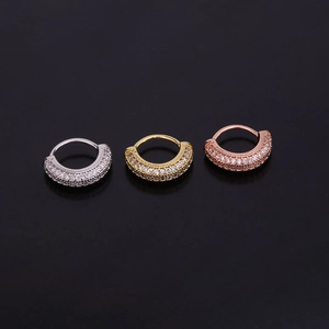 Micro-set zircon cartilage earrings in silver, gold, and rose gold on black background