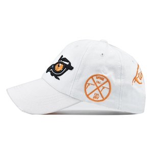 Detailed side view of white cotton baseball cap with orange and black eye embroidery