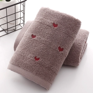 Thick cotton face towel in light brown with red heart embroidery and soft looped texture