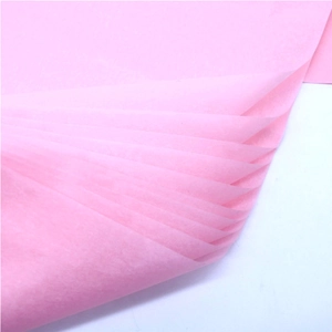 Close-up of pink translucent tissue paper for floral wrapping with delicate texture