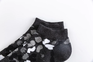 Close-up of grey camouflage cotton ankle socks with high-quality knitted texture and elastic cuff