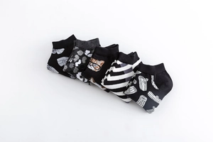 Detailed view of assorted cotton ankle socks with cat, stripe and leaf pattern designs