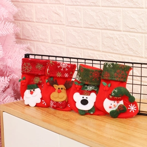 Christmas stockings set of 4 with Santa Reindeer Polar Bear Snowman on wooden desk