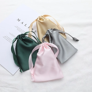 Silk satin drawstring storage bags in dark green, pink, silver, and champagne colors