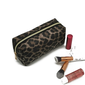 Detailed view of leopard print cosmetic bag with large capacity and zipper closure