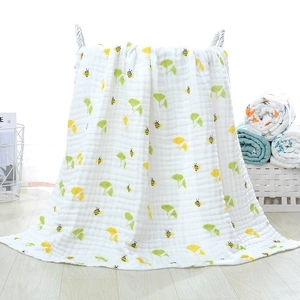 Detail of 6-layer cotton gauze baby blanket with gingko leaves and bees pattern