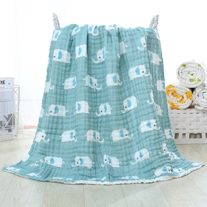 Detail of six-layer cotton gauze baby blanket featuring cartoon elephant prints in cyan blue
