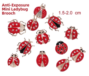 Detail view of mini ladybug pins with red enamel and rhinestones, sized 1.5-2.0 cm