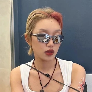 Y2K futuristic streamlined sunglasses with silver metallic frame and reflective lenses