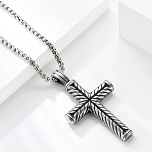 Mens stainless steel cross pendant necklace with silver box chain on white background