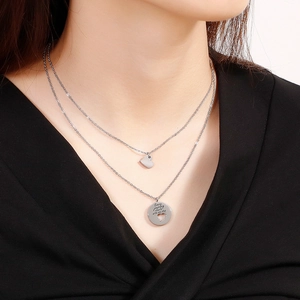 Double-layered stainless steel heart necklace with engraved Every journey starts with one step