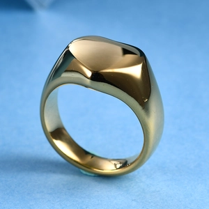 Detailed view of polished 18K gold-plated stainless steel signet ring with laser engraving