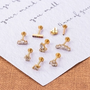 Golden titanium labret studs with cubic zirconia in various geometric shapes