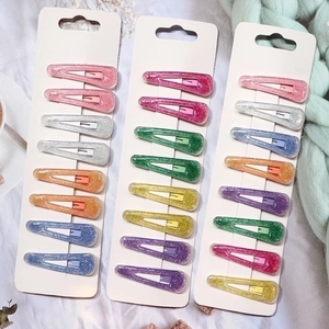 Set of 24 colorful glitter resin hair clips for girls in various vibrant candy colors