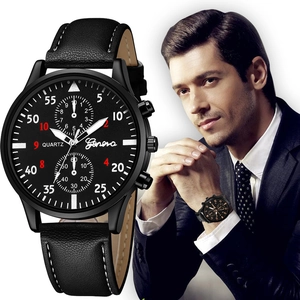 Detail of Geneva black quartz watch featuring leather strap and red numerals on dial