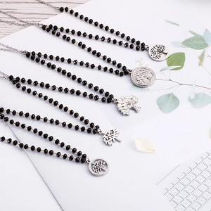 Set of five Tree of Life necklaces with black glass beads and silver steel pendants