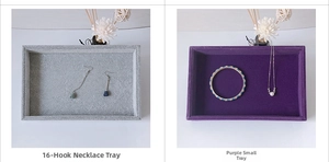 Detail view of small velvet jewelry trays in grey and purple for rings and necklaces