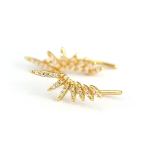 Luxurious gold sunburst stud earrings with sparkling micro-pave cubic zirconia crystals