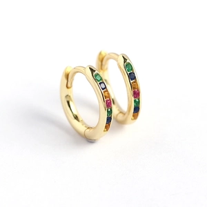 Golden hoop earrings with rainbow colored gemstones in a minimalist geometric circle design