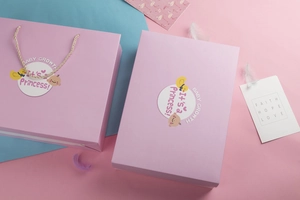 Detailed view of baby gift box with pink paper bag and Princess themed decorations