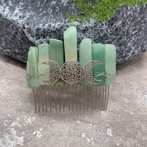 Handmade green crystal hair comb with silver Triple Moon Celtic knot design on mossy stone