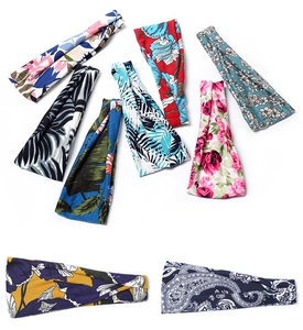 Detailed flat lay of nine elastic headbands featuring various floral and tropical patterns