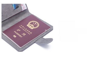 Detail of grey RFID passport holder featuring internal card slots and passport compartment