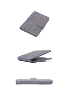 Three perspectives of a gray RFID passport wallet with snap button and charm infinite logo