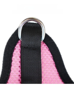 Close-up of pink breathable mesh harness with durable black strap and metal D-ring attachment